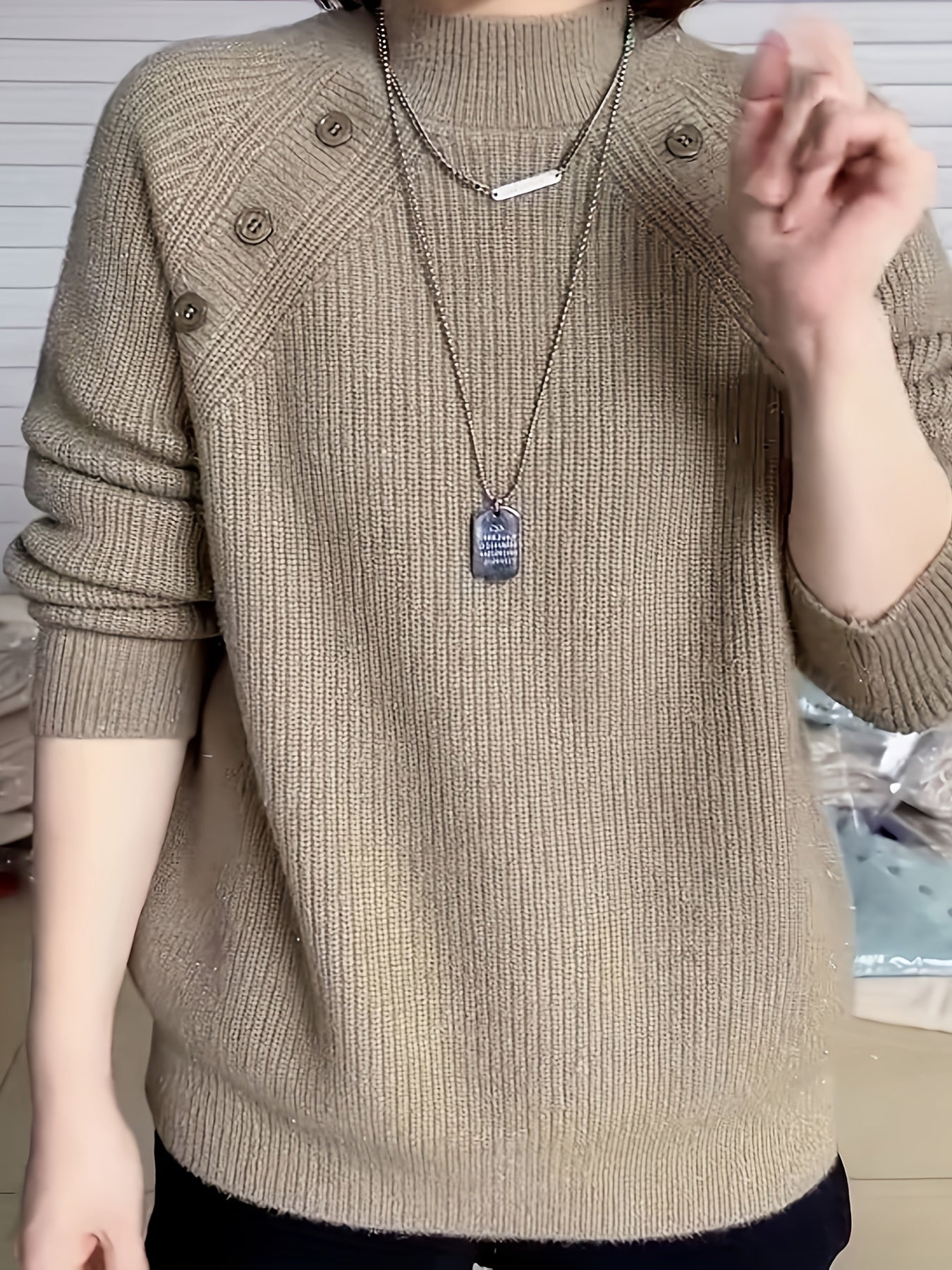 Polyester crew neck sweater for women with long sleeves, button detail, and regular fit for fall/winter.