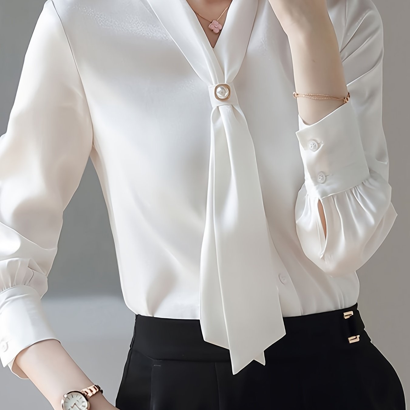 Beaded V-neck blouse with elegant long sleeves for spring and fall.