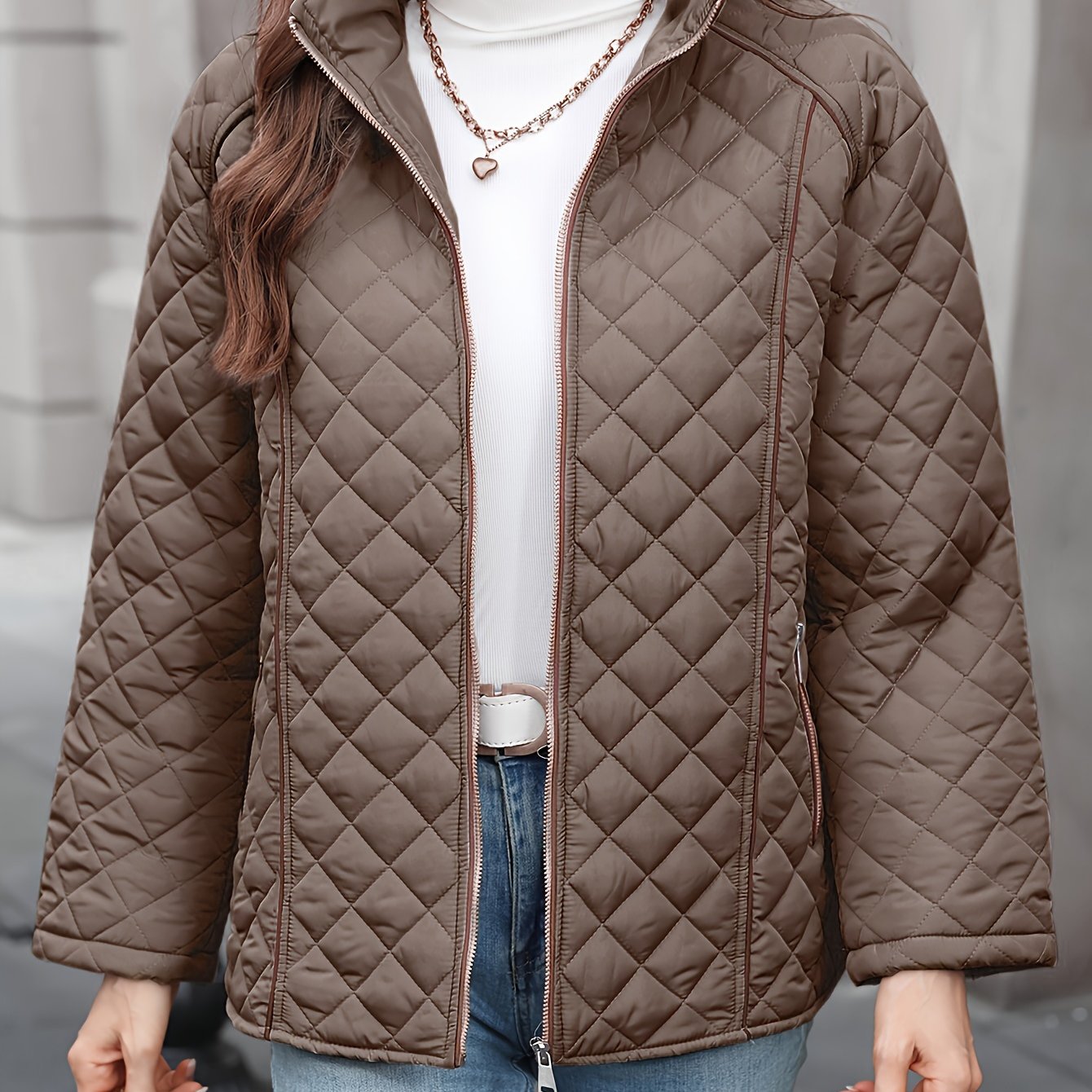 Women's plus size casual quilted outerwear with stand collar, zipper, and long sleeves. Made of 100% non-stretch solid woven polyester for fall/winter.