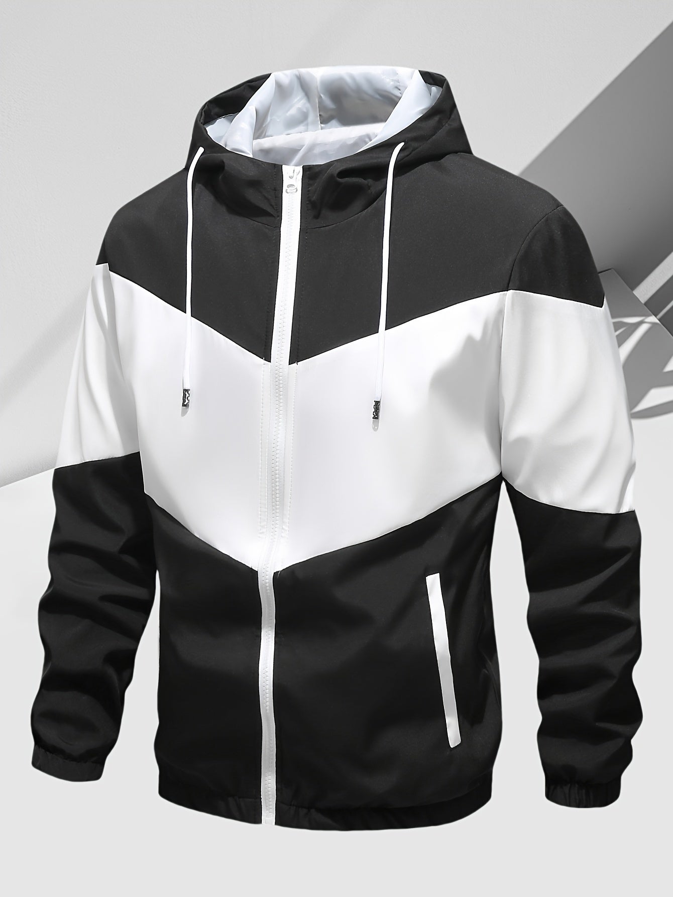 Men's casual 2-piece outfit with a stylish color block zip up hooded jacket and breathable drawstring pants.