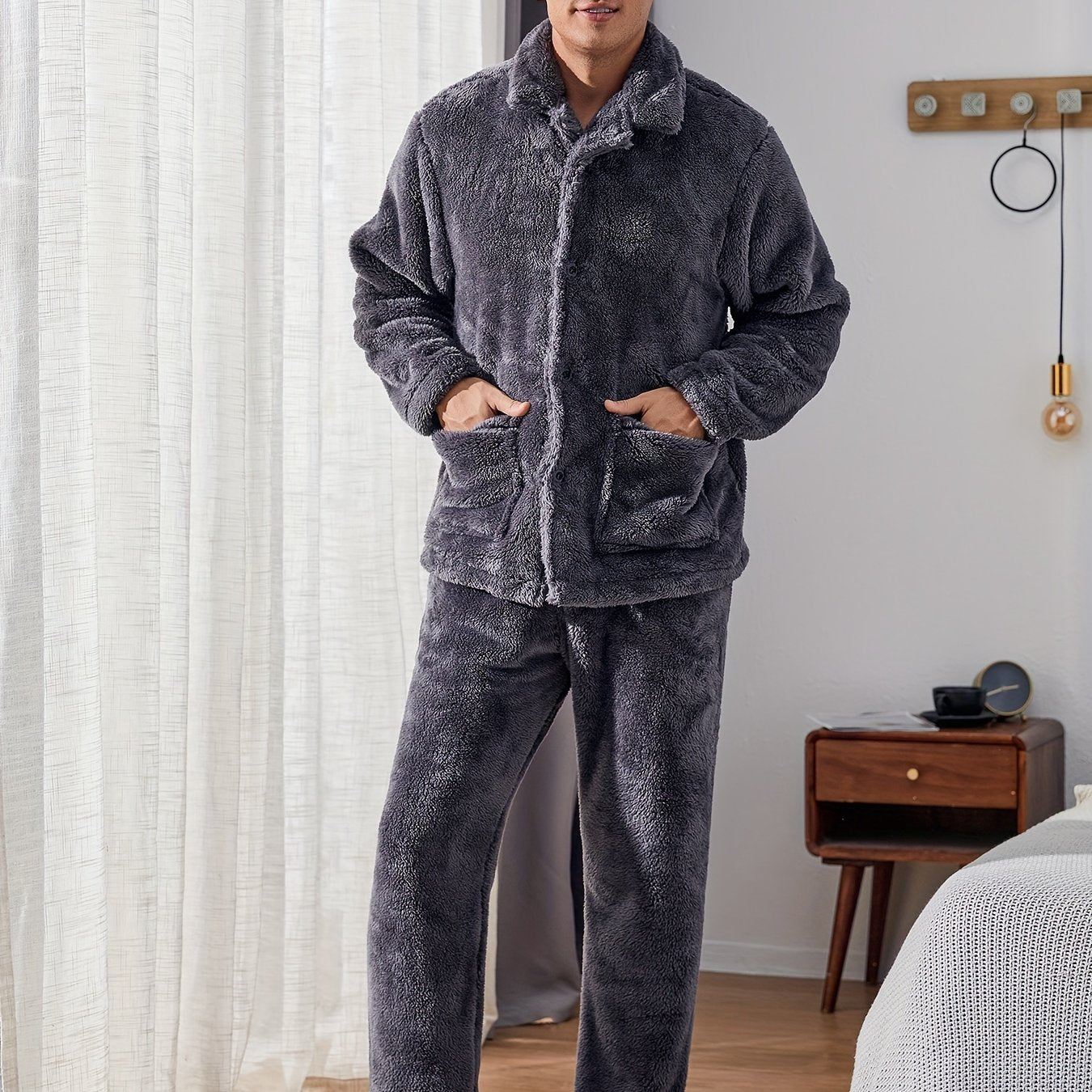 Warm and cozy men's fleece pajama set with pockets, perfect for winter. Features long sleeve top and pants. Machine washable.