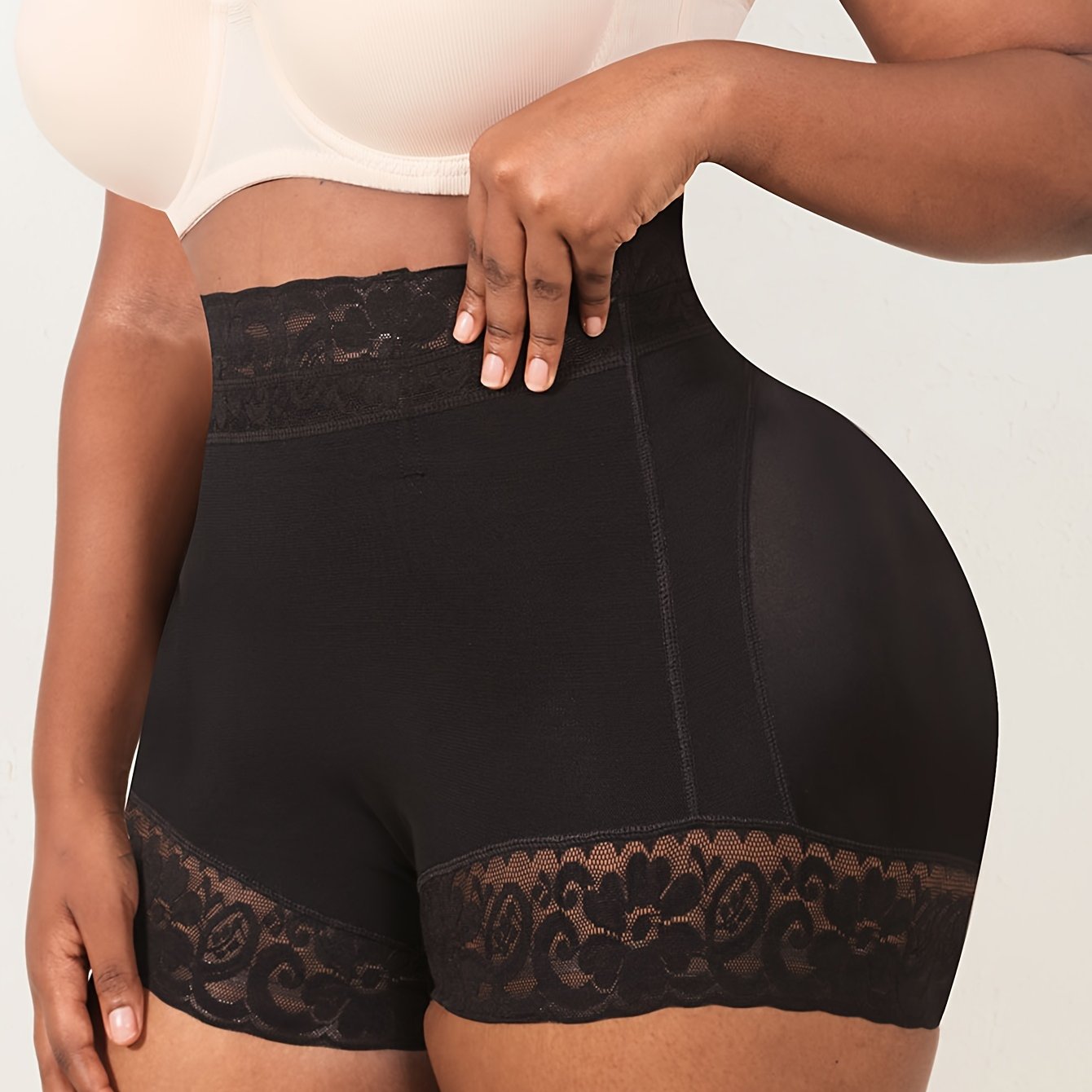 High waist shapewear shorts for plus-size women with lace trim, providing tummy control, butt lifting, and a comfortable fit.