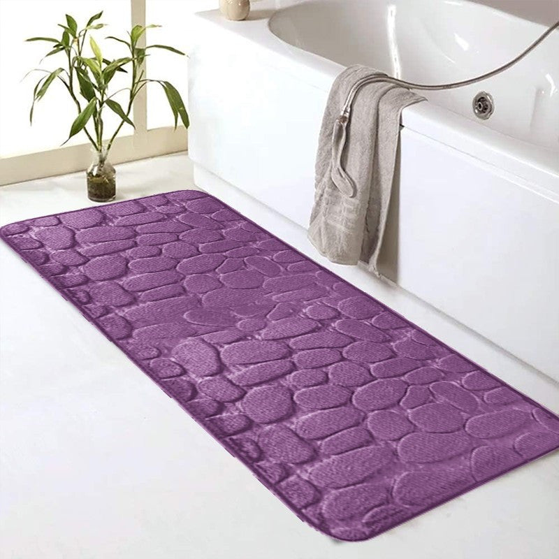 SoftTouch Cobblestone Pattern Memory Foam Bath Mat is machine washable and non-slip, making it a perfect addition to any bathroom. The absorbent polyester material resists stains, making it ideal for use in the bathtub or kitchen. This home decor runner