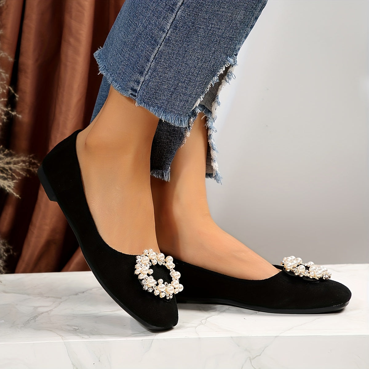 Women's black flat shoes with embellishments and comfortable fabric upper. Suitable for casual or formal occasions. Versatile and durable rubber sole.