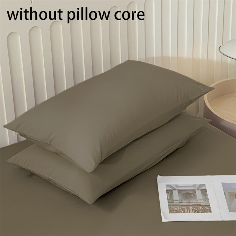 Get two ultra-soft brushed polyester pillowcases, weighing 90g each in a sleek light purple color. These rectangular pillowcases measure 50.8x76.2cm and feature an envelope closure. They are machine washable and perfect for adding cozy comfort to your