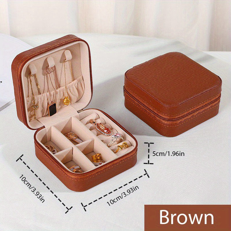 One stylish and portable jewelry box for earrings, rings, and necklaces.