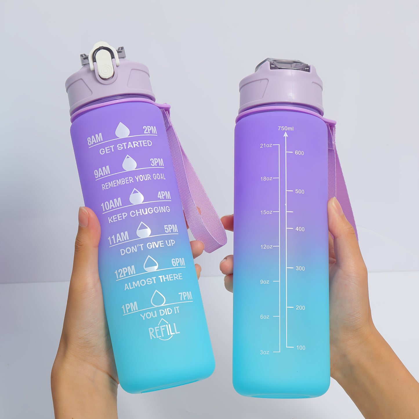 Two BPA-free plastic water bottles with time stamp and straw, lightweight and round with fixed hand strap. Hand wash only. Ideal for sports and daily use.