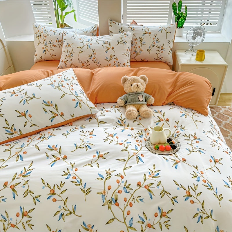 Orange flower and fruit plant pattern quilt cover set includes 1 quilt cover and 2 pillowcases in a pastoral style. Made from comfortable and skin-friendly material, it is non-ball and can be machine washed. Available in single, double, standard, and