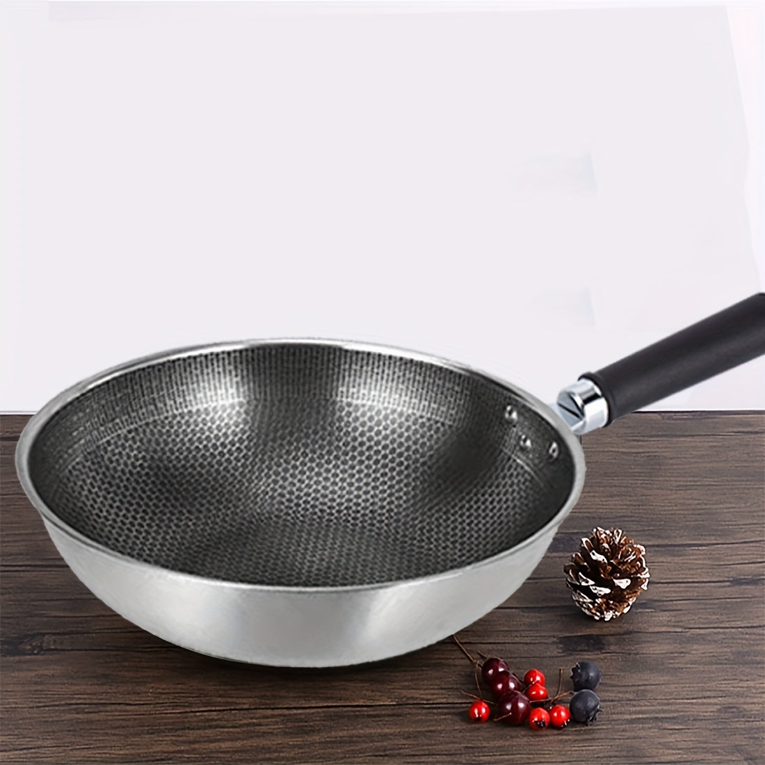 One high-quality stainless steel honeycomb wok with a reinforced glass lid - features non-stick, food-safe cast iron and a standable design for convenient storage.