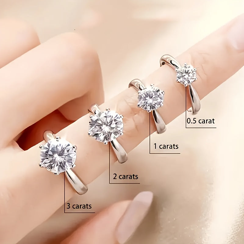 This stunning Classic Six-Prong Moissanite Promise Ring is available in 1, 2, 3, or 5 carat options. Crafted from 925 sterling silver and plated with 18k gold, this high-quality jewelry piece is perfect for engagements or marriages. It is a truly special