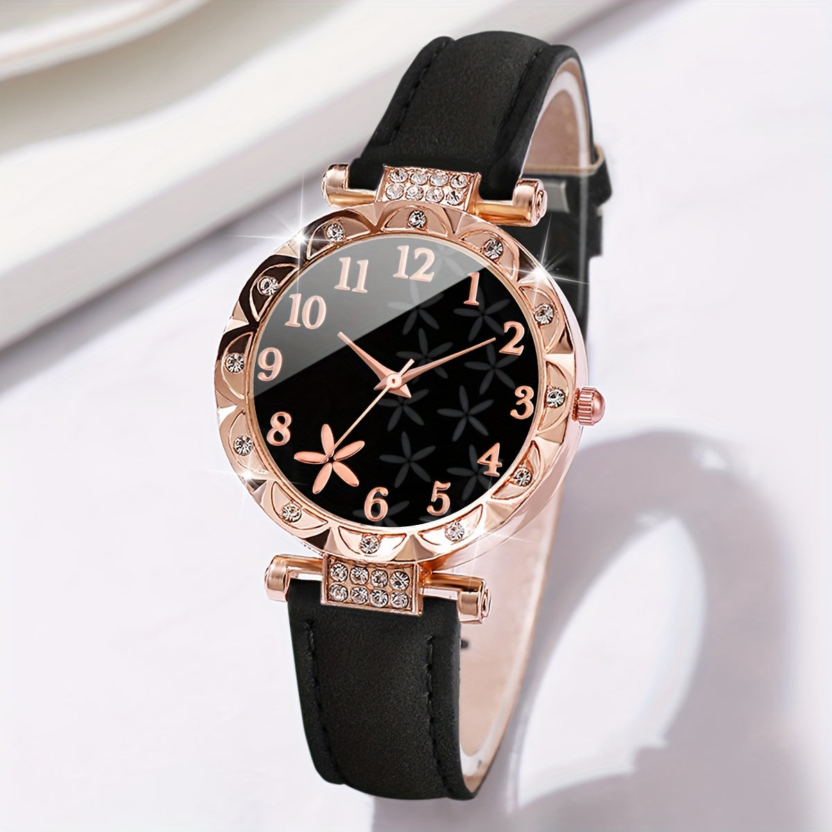 Set includes a women's fashion watch with bracelet. Features digital quartz movement, round alloy case, PU leather strap, and non-rechargeable battery. Watch box not included.