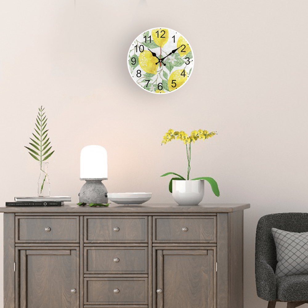 Fruit theme wall clock with golden lemon pattern design, silent non-ticking, AA battery operated. Ideal for living room and kitchen decor.