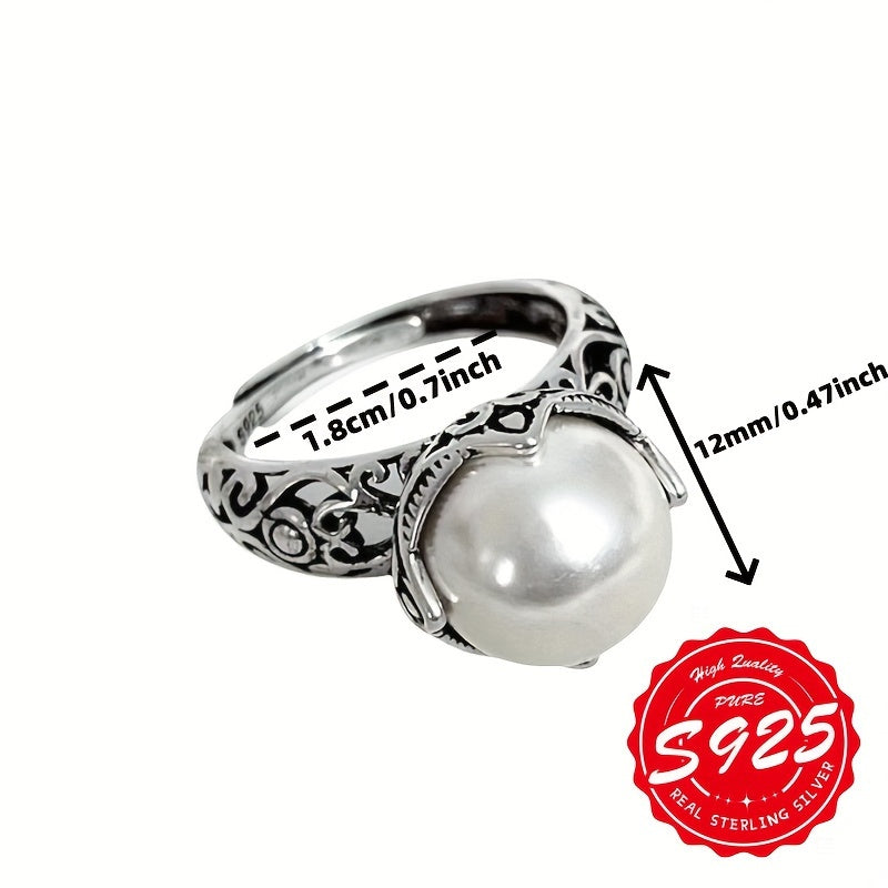 A stunning S925 sterling silver ring with a hollow carved imitation pearl, adorned with an antique Thai silvery design. This unisex Gothic style ring has an adjustable opening, making it perfect for any occasion. Lightweight at 4.16g, it is a great gift