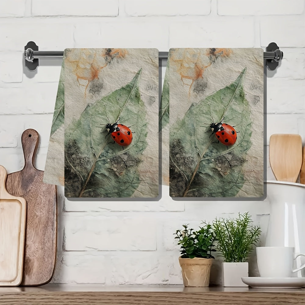 Two Coastal Style Ladybug Kitchen Towels made of highly absorbent polyester knit fabric. These machine washable hand towels are designed in a contemporary oblong shape, perfect for holiday decor. Each towel measures 40.64x60.96 cm and is ideal for drying