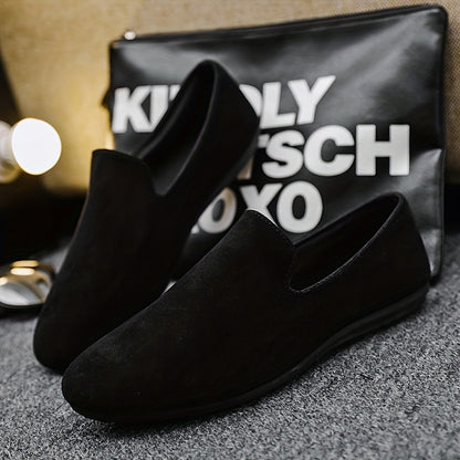 Men's black slip-on loafers with round toe and PVC sole for fashionably casual everyday wear in Spring/Summer 2024.