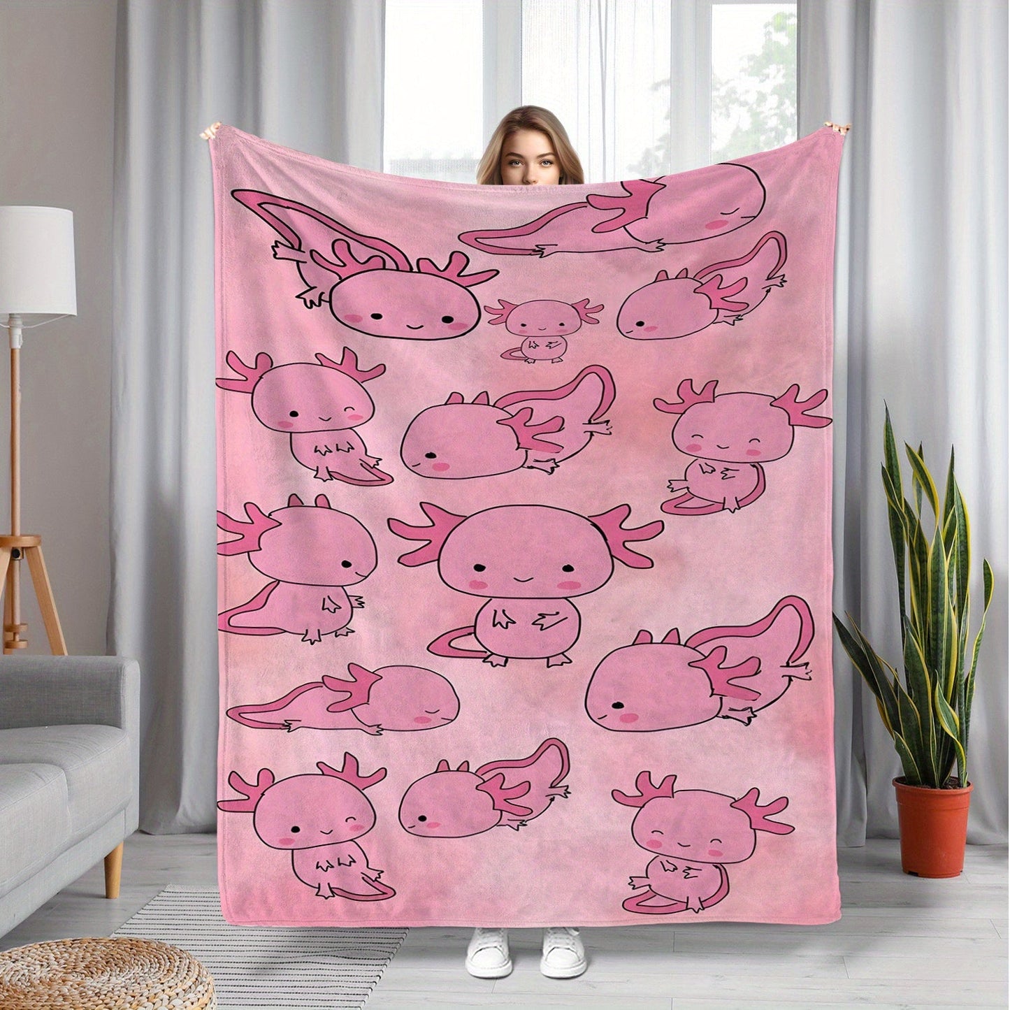 Soft, warm, and lightweight pink cartoon salamander print fleece blanket made of comfortable polyester flannel. Ideal for travel and versatile for all seasons, this contemporary style blanket is the perfect gift for boys, girls, and adults. Machine