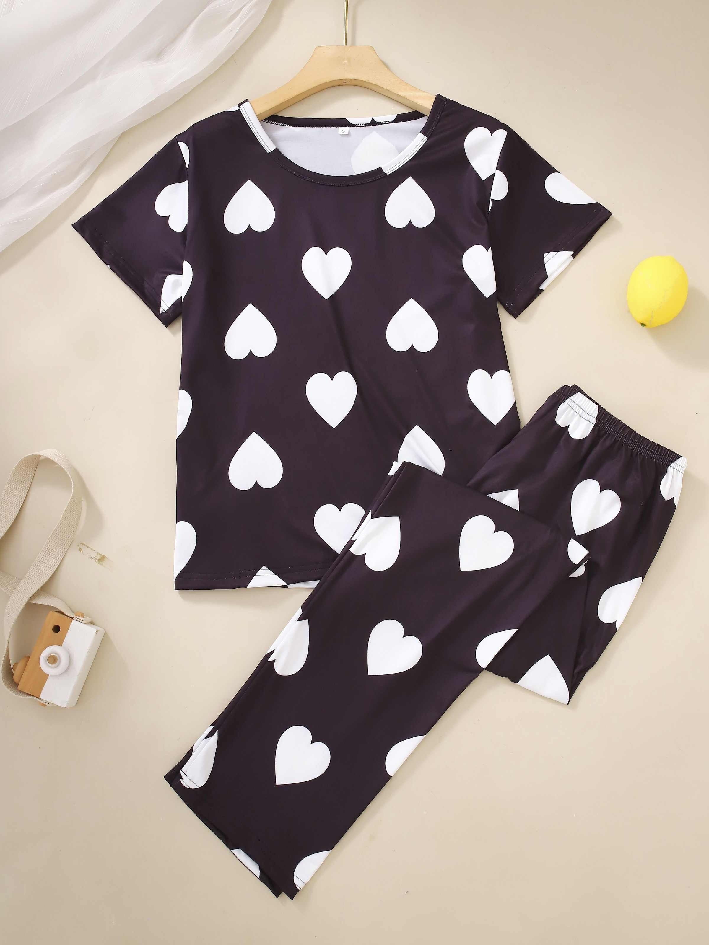 Two-piece pajama set with short-sleeved top and long pants in print.