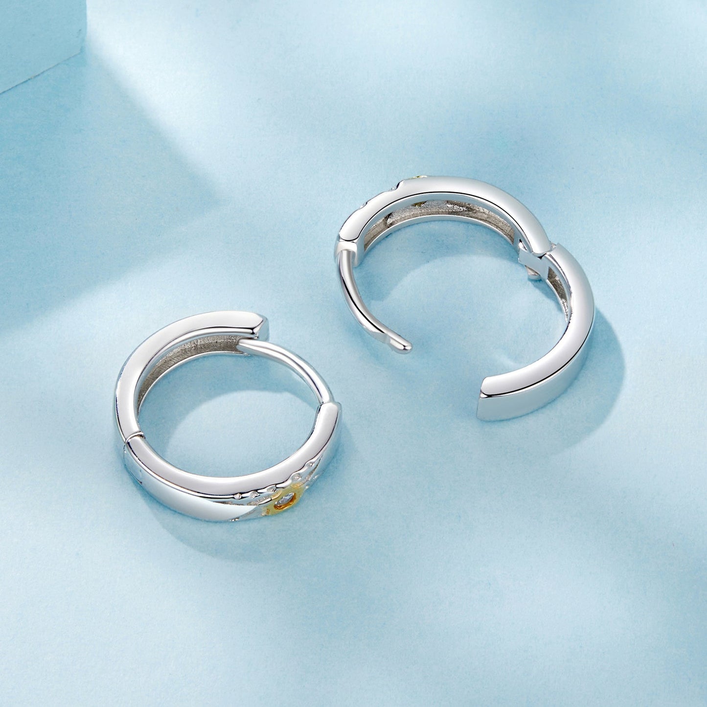 Get ready to shine at music festivals and parties with these stunning earrings! Made of elegant 925 sterling silver, these hoops feature a star accent with synthetic zirconia. They are hypoallergenic, lightweight at 3.2g, and perfect for all-season wear.