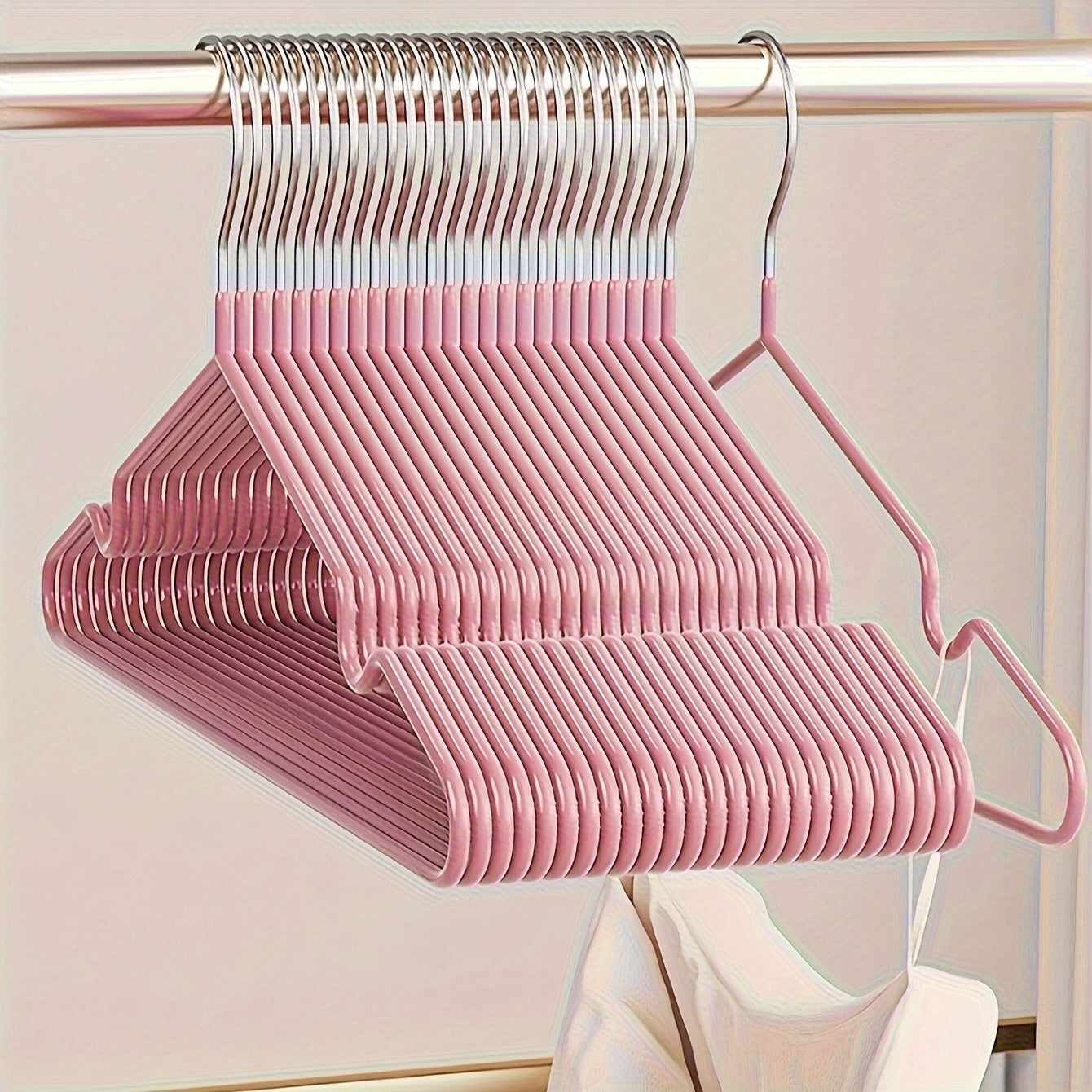 Essential for any home wardrobe, these durable non-slip metal hangers come in a convenient 10-pack. Featuring shoulder grooves to keep clothing in place, these space-saving hangers are perfect for hanging tops and dresses.