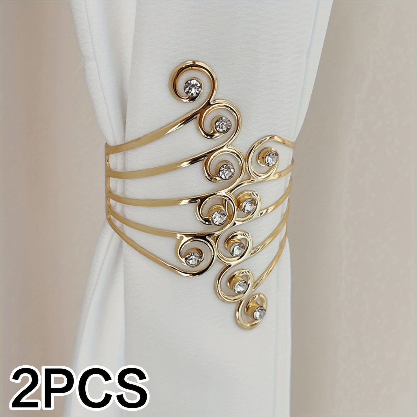 Add a touch of elegance to your home decor with these stunning Luxury Metal Gold/Silvery Creative Wings and Rhinestones Design Curtain Tiebacks. These Adjustable Skeleton Curtain Clasps are perfect for enhancing the look of your bedroom or living room