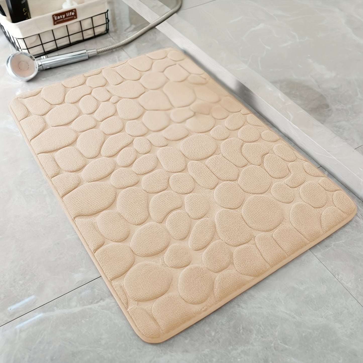 Pebble pattern bath mat in blue winter wonderland design. Non-slip, absorbent, machine washable, and fluffy.