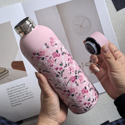 Stylish 16.9oz insulated water bottle with chic pink floral design, perfect for travel, sports, and everyday use. Great gift for birthdays and holidays.