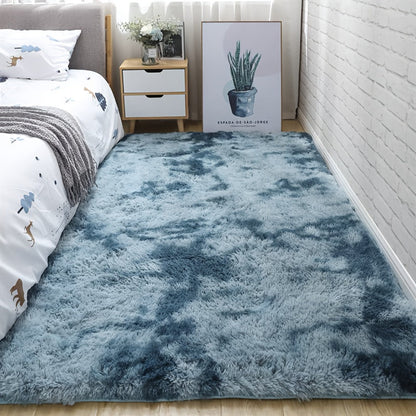 Soft fluffy area rug for bedroom, featuring a non-slip fuzzy shag plush design. This shaggy bedside rug is perfect for girls, kids, babies, teens, and dorm rooms. The tie-dyed pattern adds a fun touch to any living room or nursery. Measures 31.5*62.99