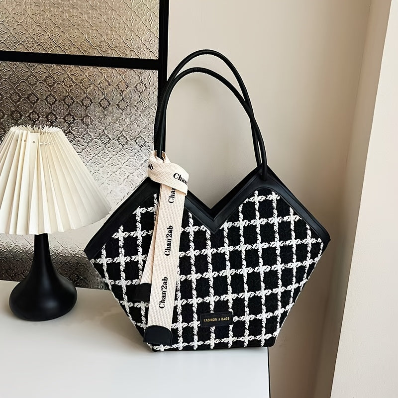 Stylish black plaid tote bag for women, spacious with zip closure and matching strap.