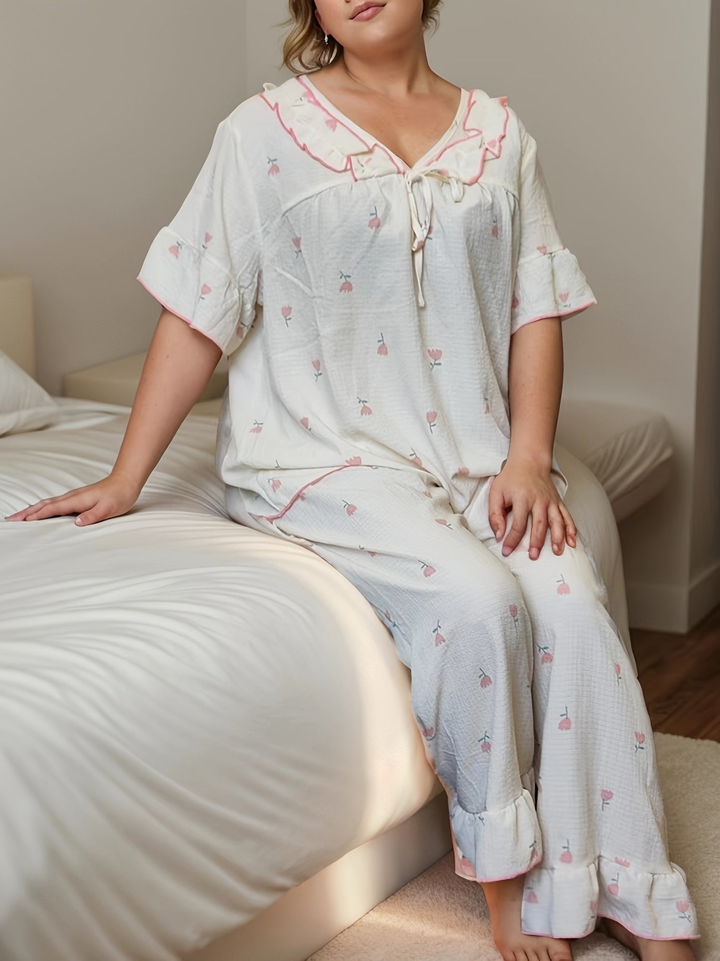 Women's printed pajama set with long pants and short sleeves in large size.