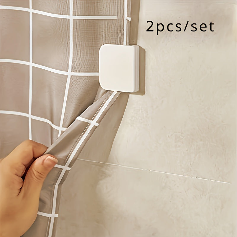 2 self-adhesive clips for shower curtains with grid pattern, prevents splashing, secure hold.