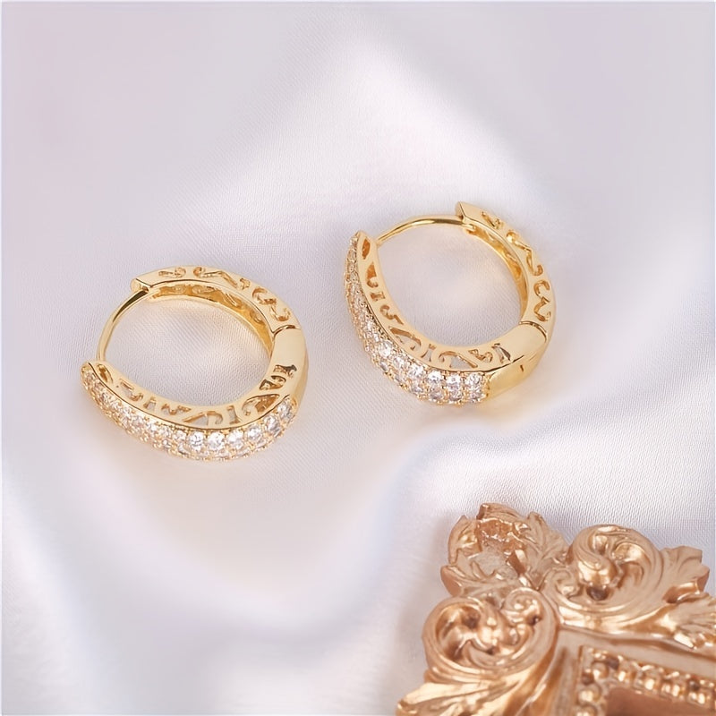 Vintage-style golden hoop earrings with sparking zirconia inlays, crafted from copper material, make a sophisticated and elegant gift for women.