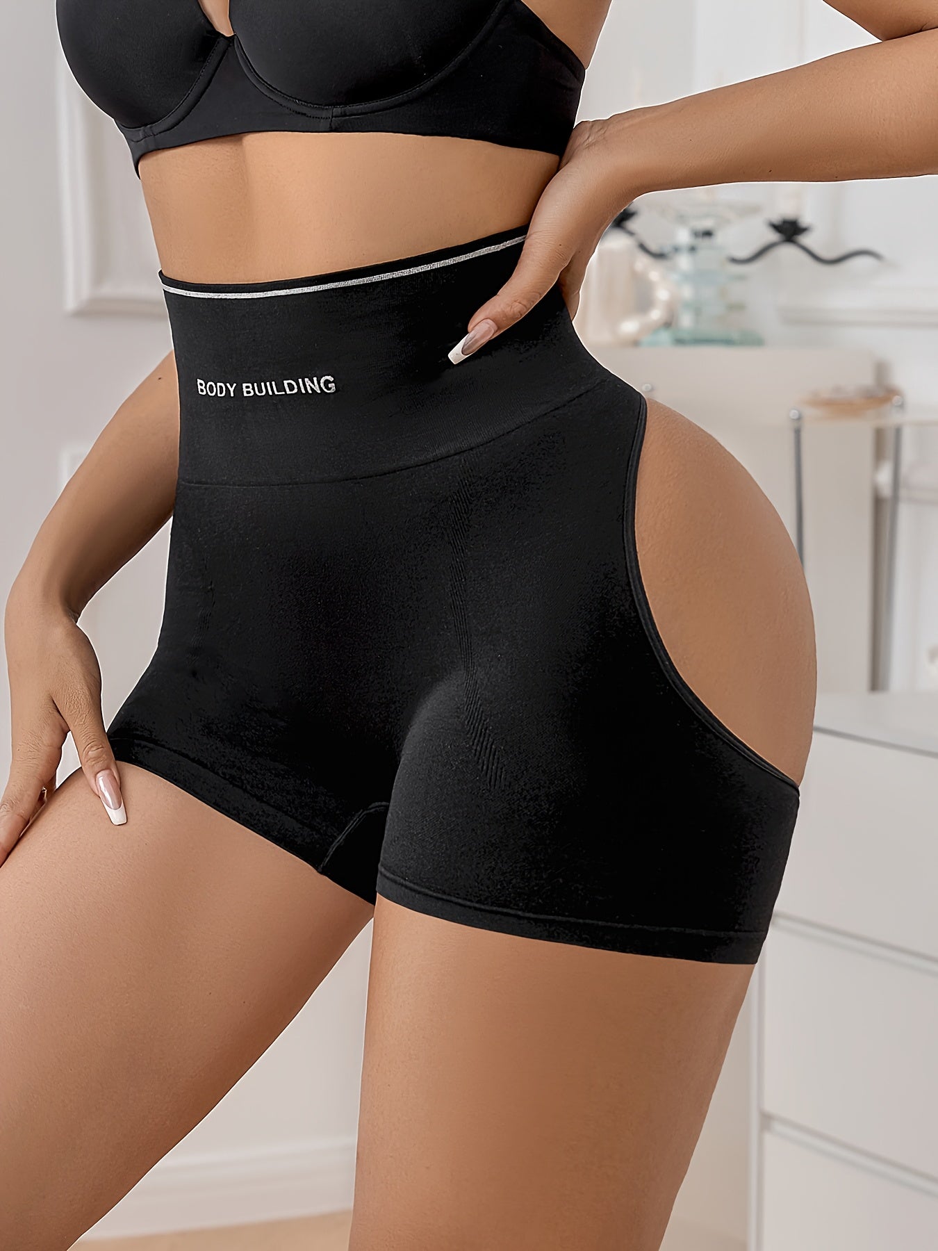 Women's High-Waist Thigh Slimmer in Solid Color, Seamless Contouring Shorts made of Polyamide and Elastane Knit Fabric with Hollow Back Detail.