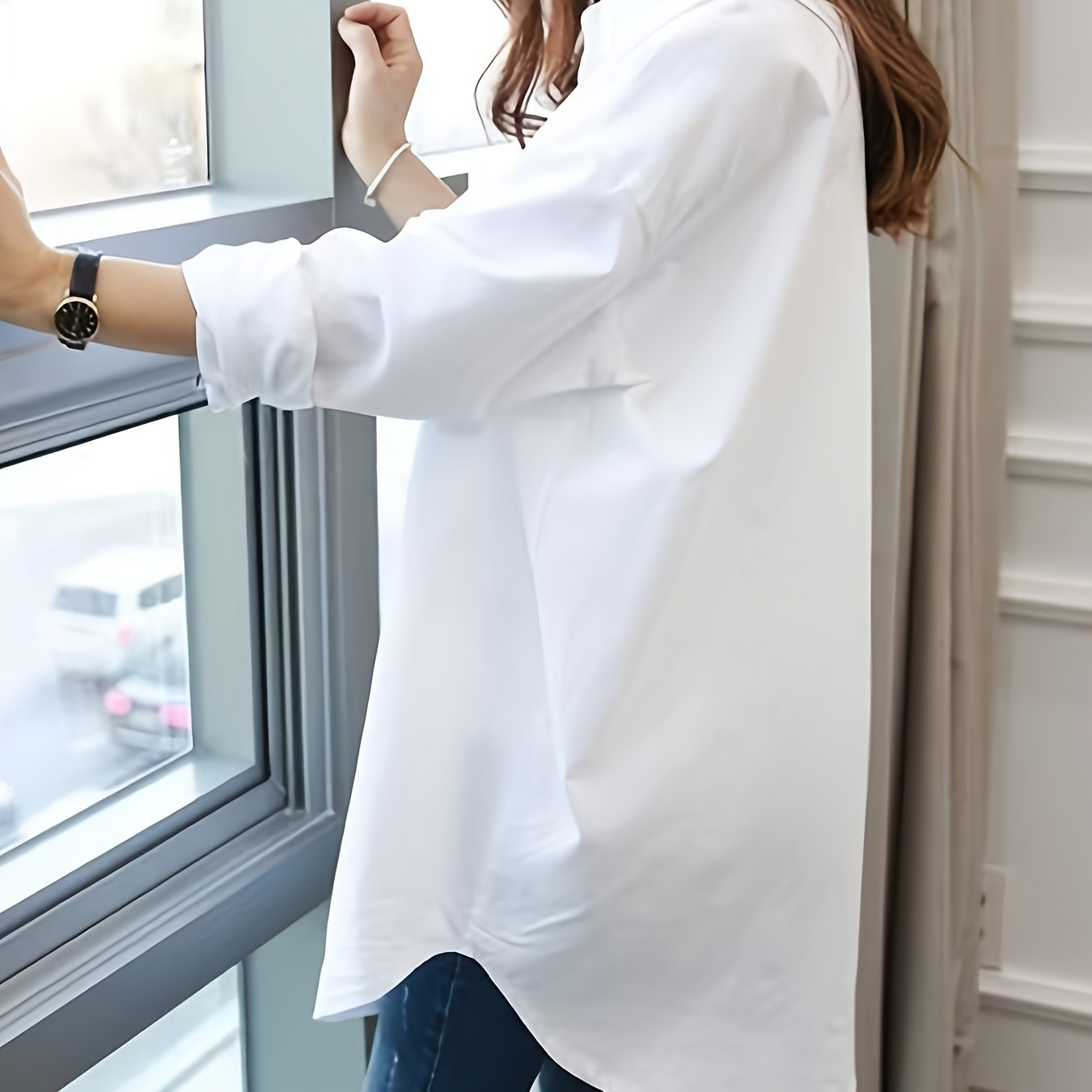 Stylish women's blouse with long sleeves, lapel collar, button detail, mermaid hem, and loose fit for all seasons.