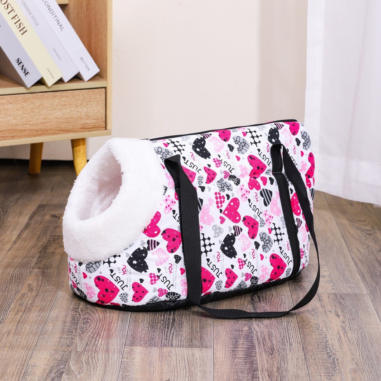 Washable, portable cat carrier bag in multi-colored design, perfect for small to medium cats. Features zippered closure and disassembled for easy litter outings.