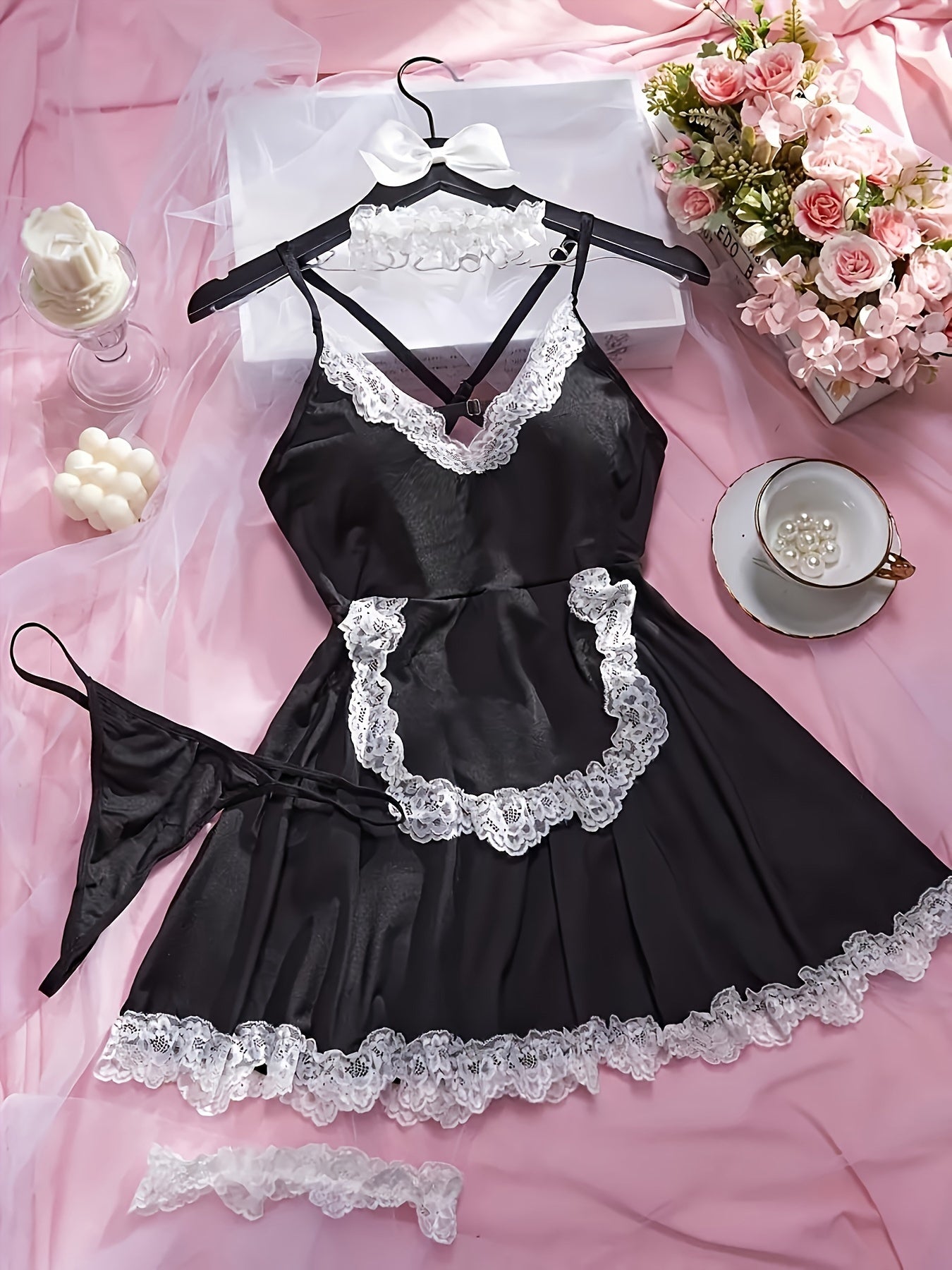 Seductive four-piece set with maid uniform, lingerie, leg rings, necklace, and underwear.