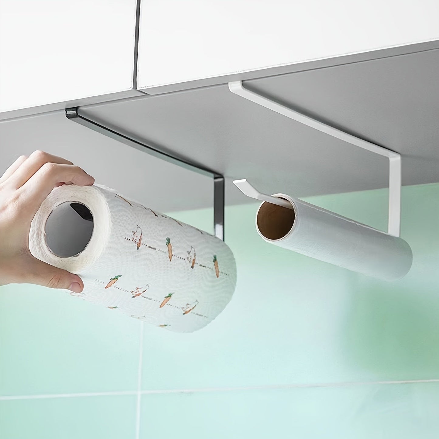 Simplify your kitchen with the 1pc Easy-Install Iron Kitchen Paper Towel Holder. This space-saving cabinet roll organizer requires no drilling and can also hold cling film and dishcloths. Its modern design makes it a stylish addition to your kitchen