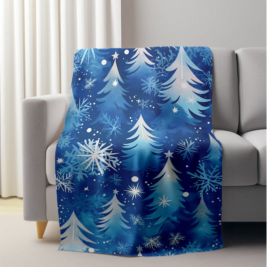 This modern blue snowflake and pine tree pattern flannel blanket is perfect for winter dreams. It's lightweight, plush, and comfortable, making it ideal for snuggling up on the sofa or taking a nap at the office. This versatile blanket is also great for