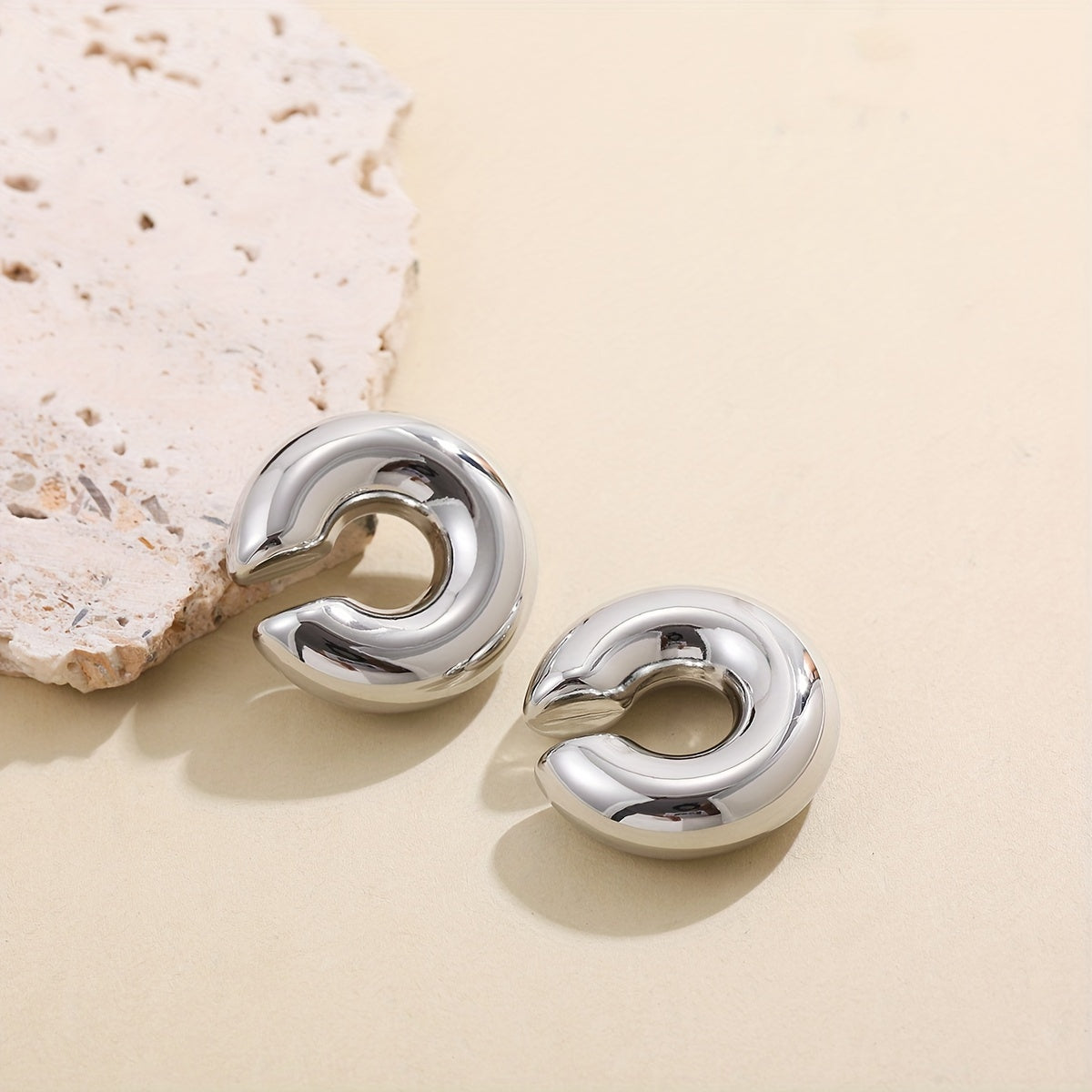 A set of stylish and elegant stainless steel hoop earrings, featuring a hollow C-shaped design. Perfect for daily wear, vacations, and the Ramadan holiday season. Versatile and suitable for all seasons.