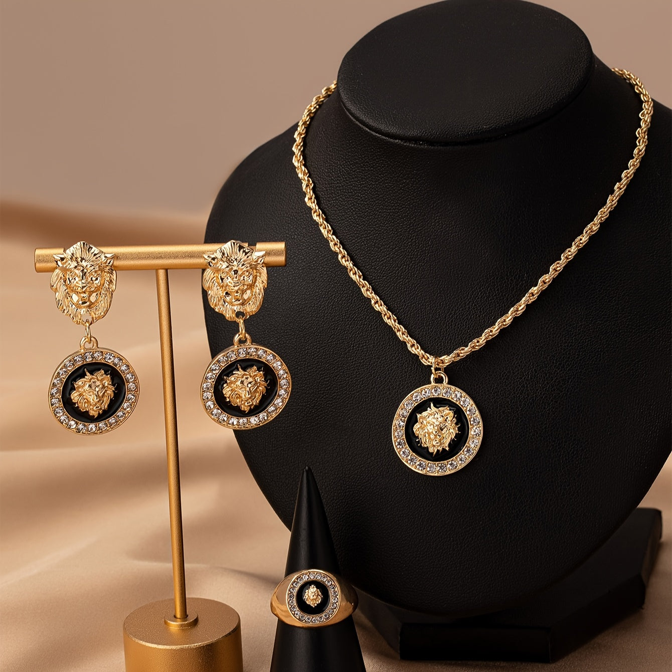 A set of European and American retro elegant temperament lion head jewelry, including an enamel charm necklace, a pair of charm earrings, and a ring adorned with lion heads.