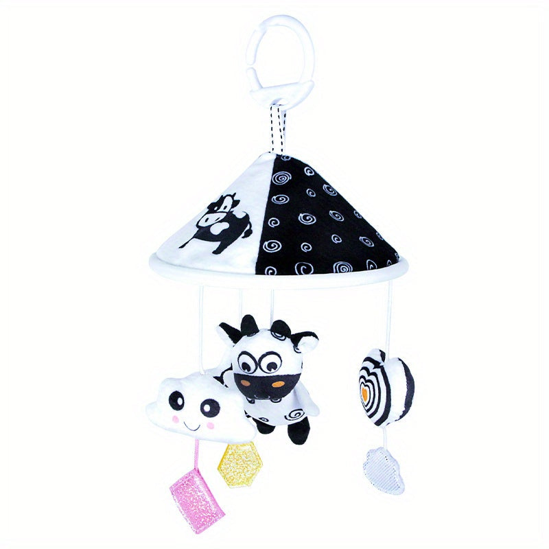 Baby toy car in black and white hanging from the baby trolley, with an umbrella wind chime for early education. The crib bell and stroller hanging umbrella bed bell pendant features black and white animal wind chimes. Additionally, there is a bed hanging