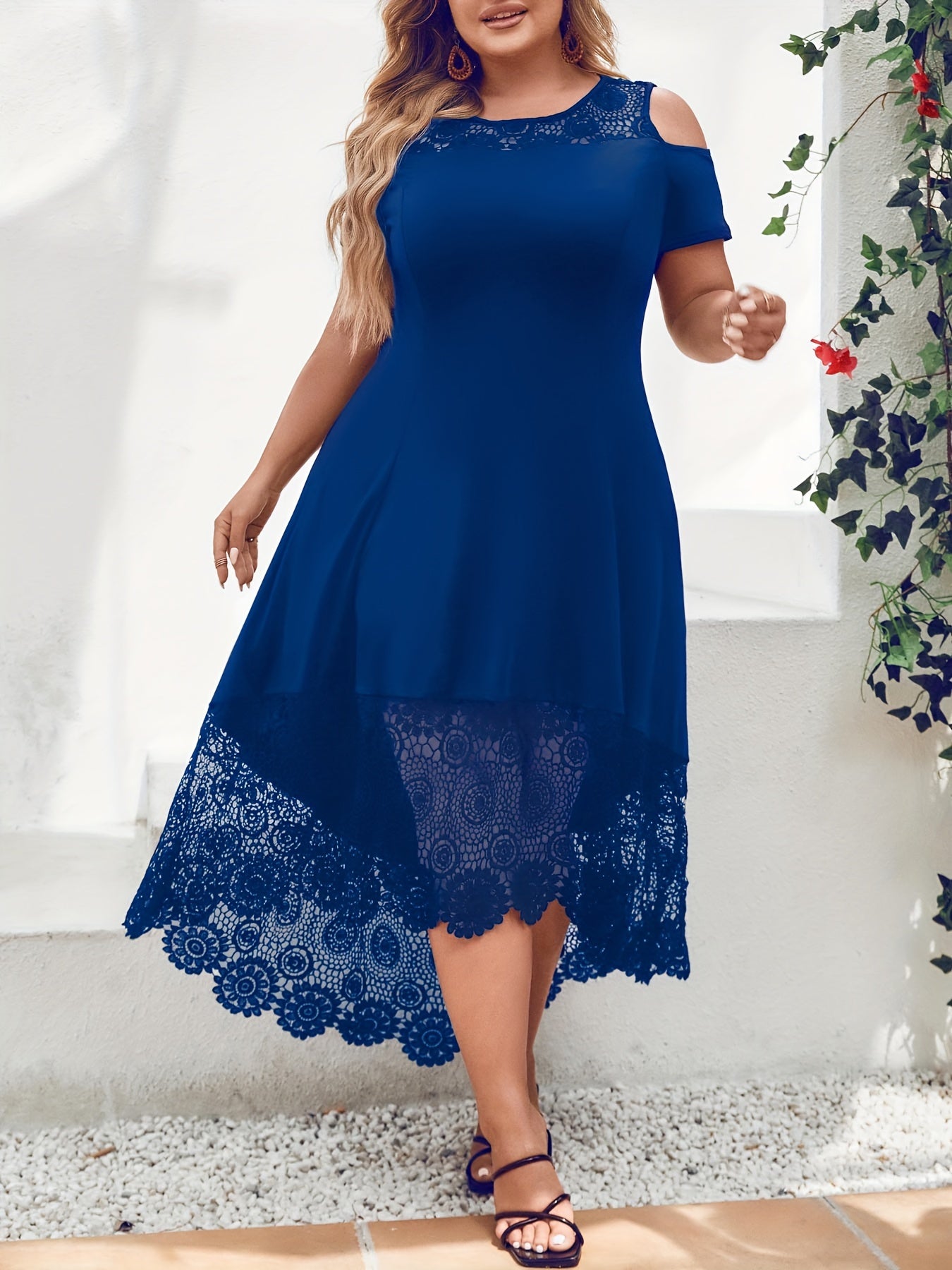 Stylish plus size black dress with white lace panel features off-shoulder design, short sleeves, and asymmetrical hem. Made of medium stretch, machine washable fabric, this dress is ideal