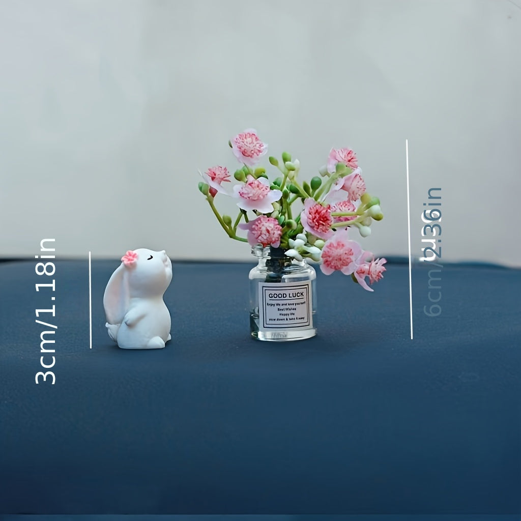 Miniature resin vase for car dashboard décor with healing figurine.