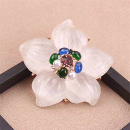 One piece of a luxurious iridescent floral brooch pin adorned with rhinestones. This elegant accessory features a novel simulated modeling design, making it a versatile fashion addition to clothing, bags, and hats.