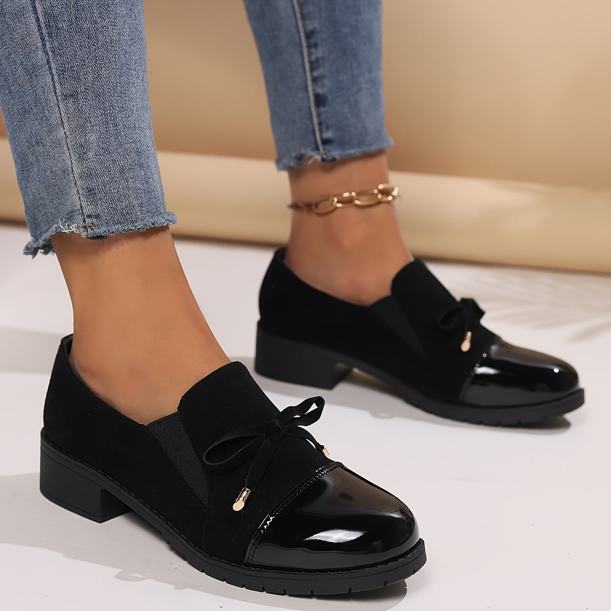 Retro bowknot loafers for women - breathable slip-on casual shoes with chunky heel, black cover upper, all-season comfort. Round toe design and decorative strap detail.