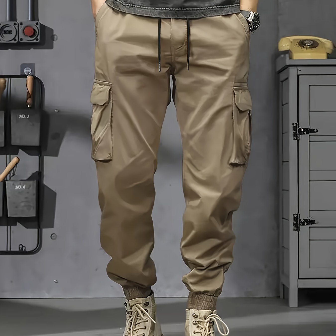 Durable polyester cargo pants with multiple pockets for outdoor work and casual wear in plus sizes.