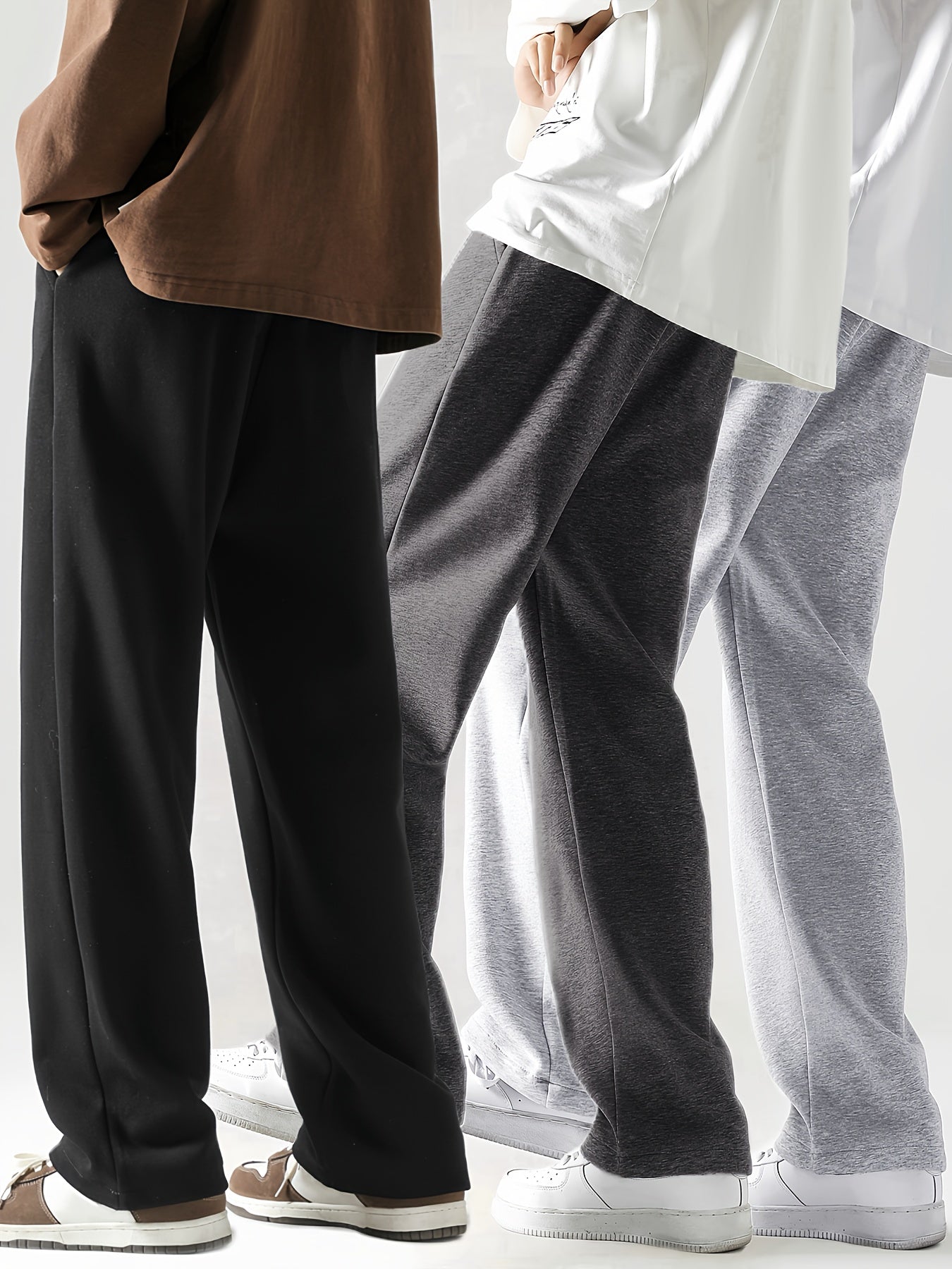 Men's loose straight-leg long pants in solid colors, perfect for spring and autumn fitness activities. Made from soft, slightly stretchy knitted fabric with a drawstring waist. Suitable for