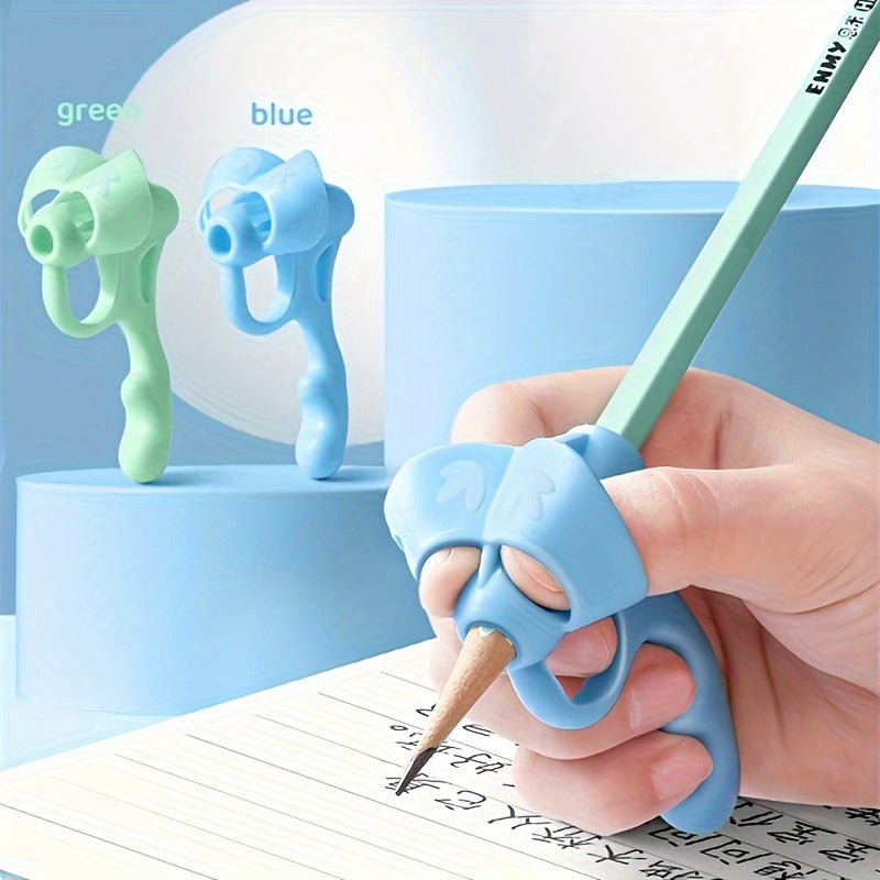 Writing corrector set with soft rubber grip for improving handwriting posture.