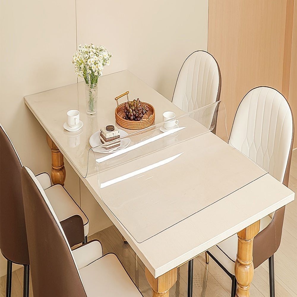 Thick and transparent tablecloth for home, hotel, and restaurant use, with anti-scratch and heat-resistant properties.