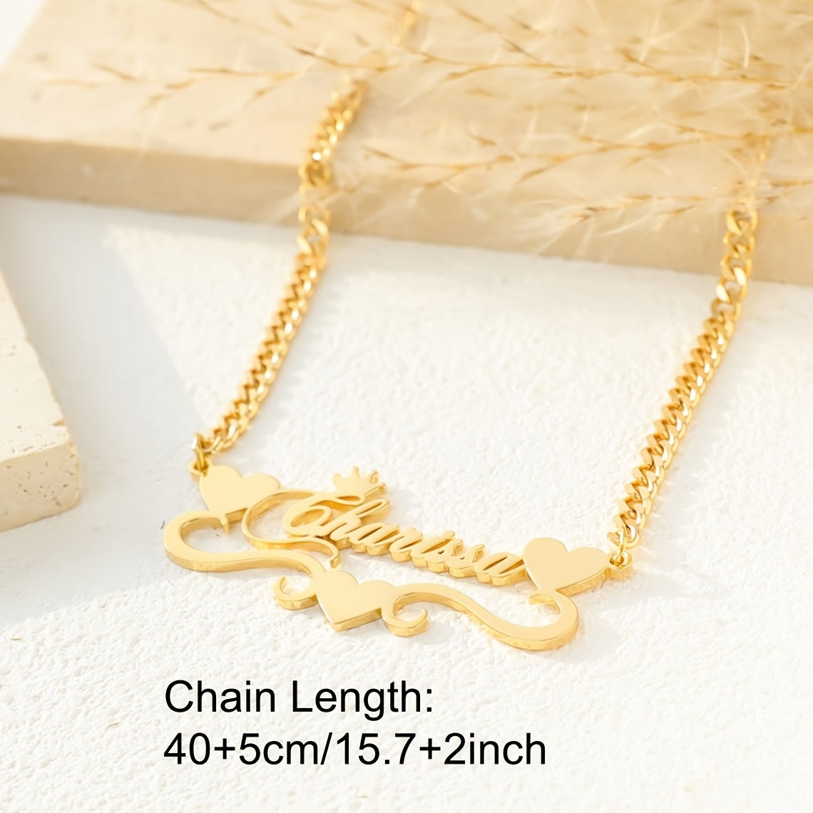 A single elegant custom 4MM Cuban link chain necklace with personalized name pendant, featuring a stainless steel heart ribbon plaque. This fashion crown jewelry for women is a versatile daily accessory suitable for all-season wear.