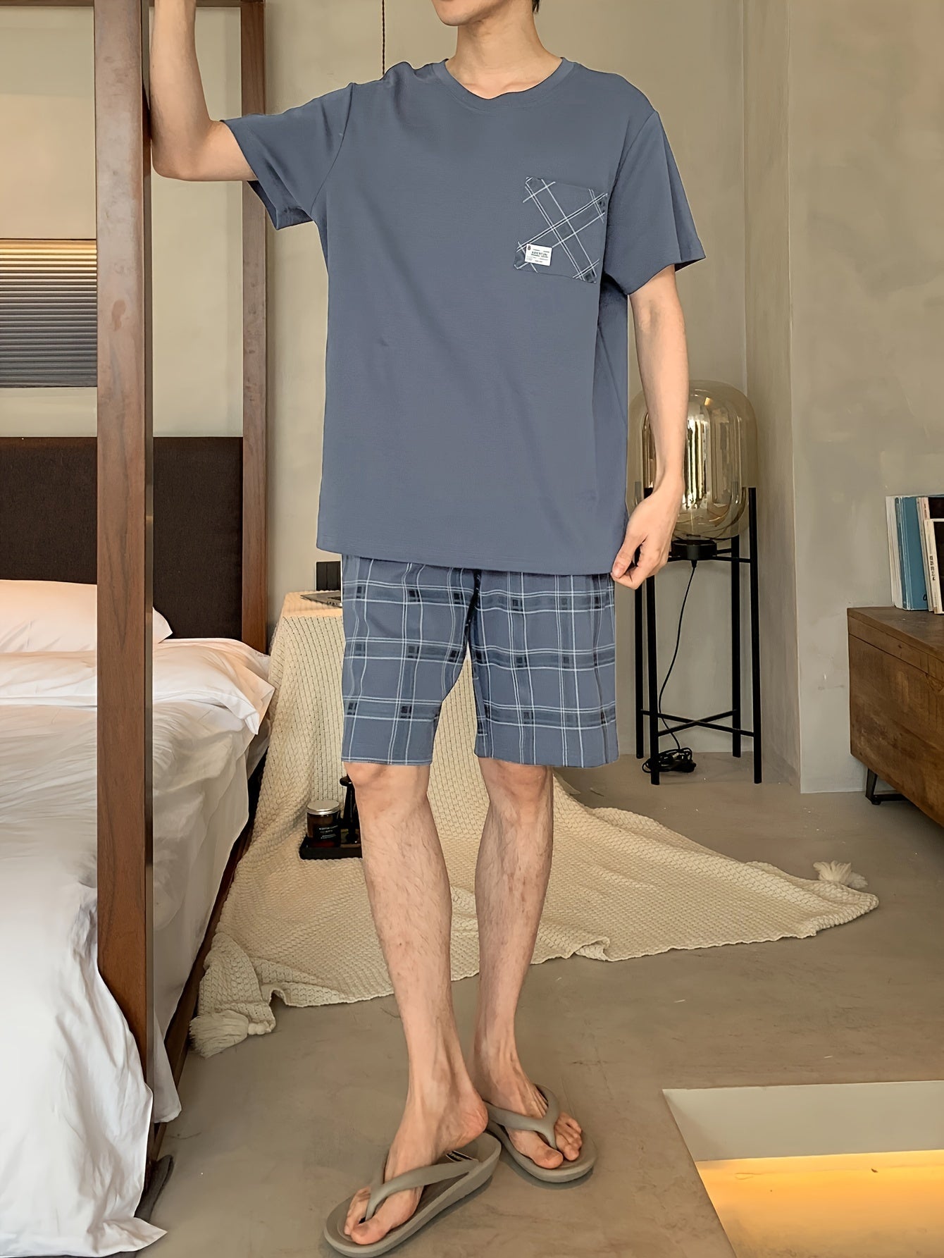 Men's stylish and comfortable 2-piece cotton pajama set with short sleeve top and shorts for lounging at home.